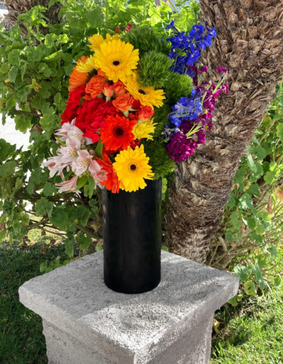 Rainbow LGBTQ pride flowers and roses. A custom Bloom Parlor floral arrangement and design.